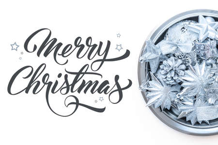 Bowl full of shiny blue christmas ornaments isolated over white background. Christmas background with copy space.の写真素材