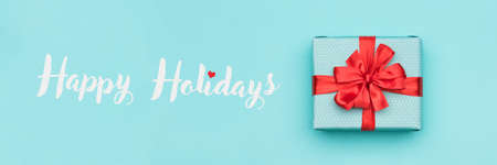 Christmas banner. Pastel blue festive winter holidays backdrop.の写真素材