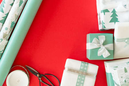 DIY Gift Wrapping. Beautiful nordic christmas gifts Christmas wrapping station concept top view...