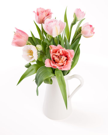 Elegant mixed tulips pink colored spring bouquet on white background. Spring tulips. Tulips bouquet.の写真素材