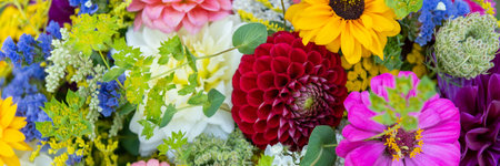 Summer bouquet. Beautiful multi colored fresh flower arrangement. Locally sourced flowers birthday bouquet close up.の写真素材