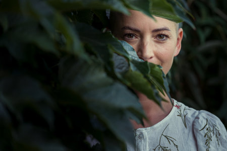 Beautiful young positive female cancer survivor smiling outdoors portrait. Life and health insurance concept.の写真素材