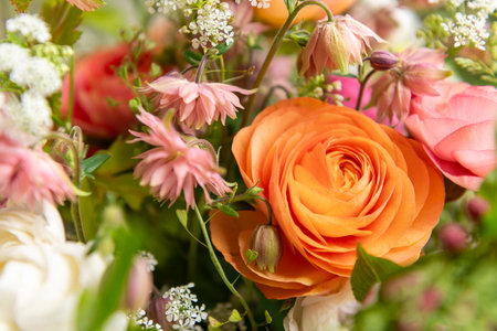 Spring mixed ranunculus bouquet. Beautiful pastel colored fresh flowers arrangement. Birthday bouquet made of ranunculus photographed outdoors.の写真素材