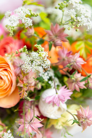 Spring mixed ranunculus bouquet. Beautiful pastel colored fresh flowers arrangement. Birthday bouquet made of ranunculus photographed outdoors.の写真素材