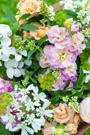 Bouquet made of mixed spring flowers. Beautiful pastel colored fresh flowers arrangement. Birthday bouquet with snapdragons and matthiola stock.の写真素材