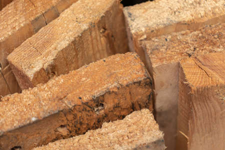 pieces of wood stacked to buildの写真素材