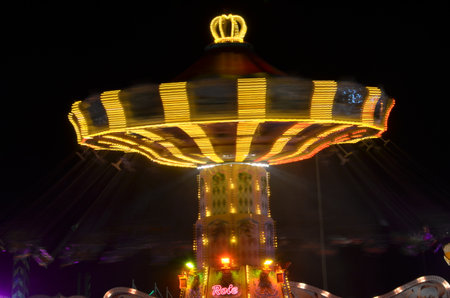 Karusell carousel at night light painting long exposure Kirmes Jahrmarktの写真素材