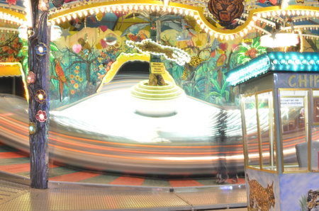 Karusell carousel at night light painting long exposure Kirmes Jahrmarktの写真素材