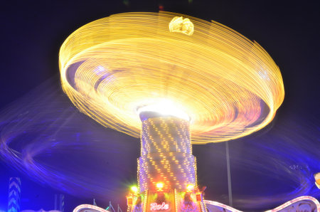 Karusell carousel at night light painting long exposure Kirmes Jahrmarktの写真素材