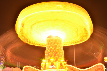 Karusell carousel at night light painting long exposure Kirmes Jahrmarktの写真素材