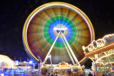 Karusell carousel at night light painting long exposure Kirmes Jahrmarktの写真素材
