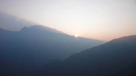 Amdes Sky and Mountains with Sun Beamsの写真素材