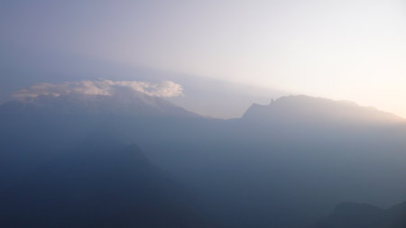 Amdes Sky and Mountains with Sun Beamsの写真素材
