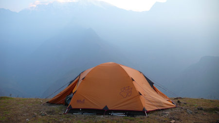 Orange Tent in the Wild Sunrise Mountain Viewの写真素材