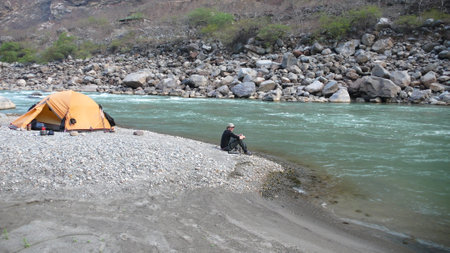 Orange Tent on Andes River Trekking traveling adventureの写真素材