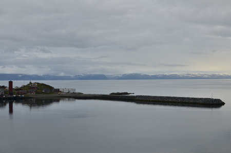 cloudy Fjord Norway ocean mirroring cold waterの写真素材