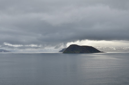 cloudy Fjord Norway ocean mirroring cold waterの写真素材