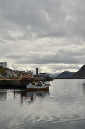Harbour with smal fishing boats Norway rough cold wetの写真素材