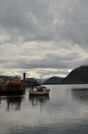 Harbour with smal fishing boats Norway rough cold wetの写真素材