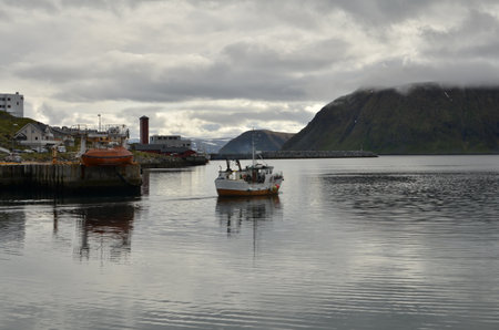 Harbour with smal fishing boats Norway rough cold wetの写真素材