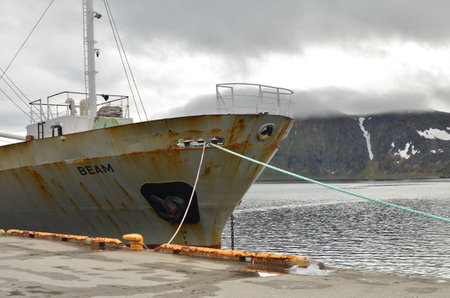 Harbour with smal fishing boats Norway rough cold wetの写真素材