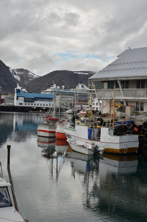 Harbour with smal fishing boats Norway rough cold wetの写真素材