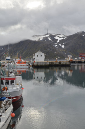 Harbour with smal fishing boats Norway rough cold wetの写真素材