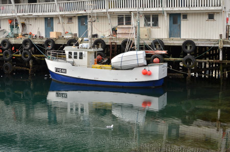 Harbour with smal fishing boats Norway rough cold wetの写真素材