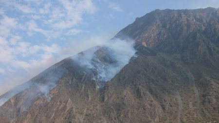 Andes Mountains burning slash and burn beautifull scenery blue sky landskapeの写真素材