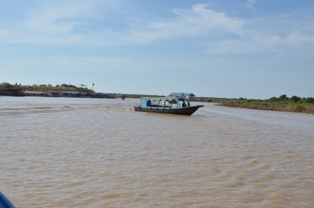 Long Tail Boat an Fisherman Mekong River phnom Phen Cambodiaの写真素材