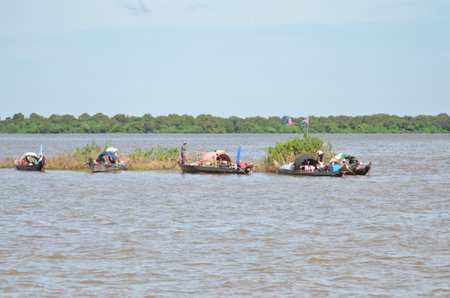 Boats an Fisherman Mekong River phnom Phen Cambodiaの写真素材