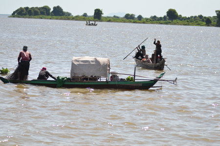 Boats an Fisherman Mekong River phnom Phen Cambodiaの写真素材