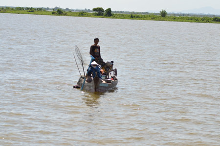 Boats an Fisherman Mekong River phnom Phen Cambodiaの写真素材