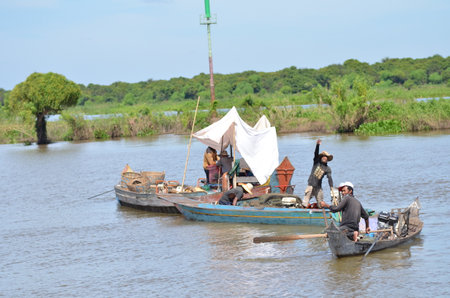 Boats an Fisherman Mekong River phnom Phen Cambodiaの写真素材