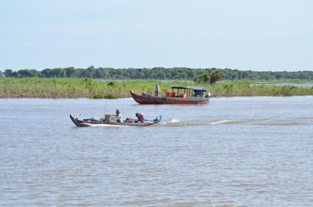 Boats an Fisherman Mekong River phnom Phen Cambodiaの写真素材