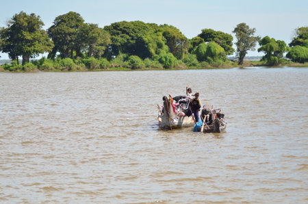 Boats an Fisherman Mekong River phnom Phen Cambodiaの写真素材