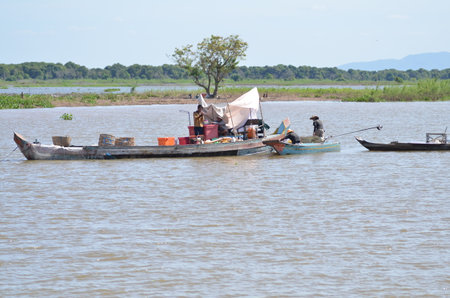 Boats an Fisherman Mekong River phnom Phen Cambodiaの写真素材