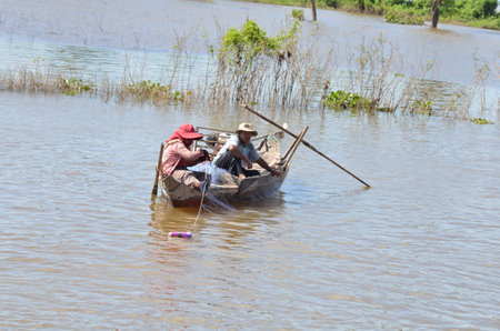 Boats an Fisherman Mekong River phnom Phen Cambodiaの写真素材