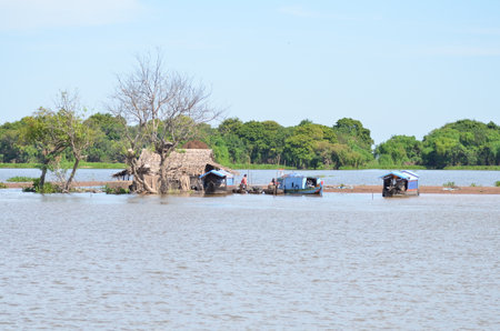 Boats an Fisherman Mekong River phnom Phen Cambodiaの写真素材