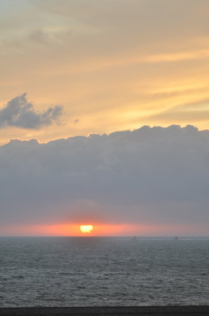 Sunset with clouds over Ocean oastell calm backgroundの写真素材