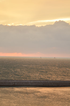 Sunset with clouds over Ocean oastell calm background