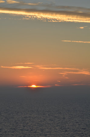 sunset at Sea ocean to horizon colorfull pastell calmの写真素材