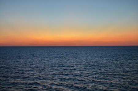 Sun is gone Dawn at Sea colorfull Ocean Horizonの写真素材