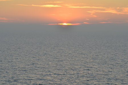 sunset at Sea ocean to horizon colorfull pastell calmの写真素材