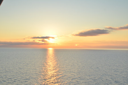 Bright Sunset mediterranean Sea Italy colorfull reflection on Oceanの写真素材