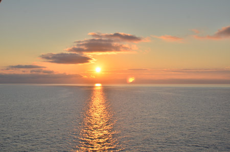 Bright Sunset mediterranean Sea Italy colorfull reflection on Oceanの写真素材