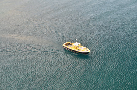 yellow Boat on Blue Water Caribic cruiseの写真素材