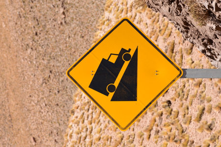 Truck road sign steep track in desert of chile. High quality photo