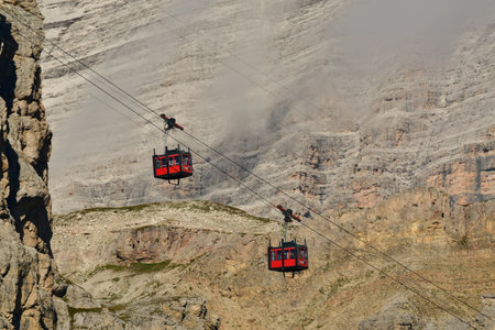 Lagazuoi mountain ropeway red blue sky detail rocks. High quality photo