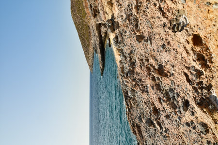 rough and rocky shore line of Kalymnos Island Greece. High quality photoの写真素材